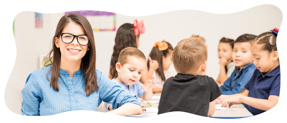 teacher proud of her students sitting at table